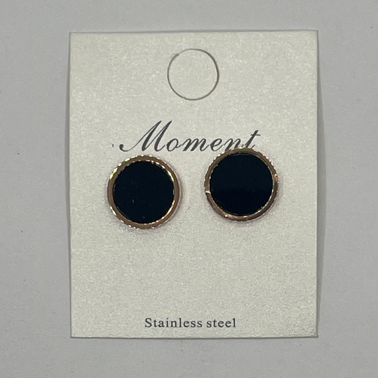 Black earrings with STAINLESS STEEL rims on a 'Moment' branded card.