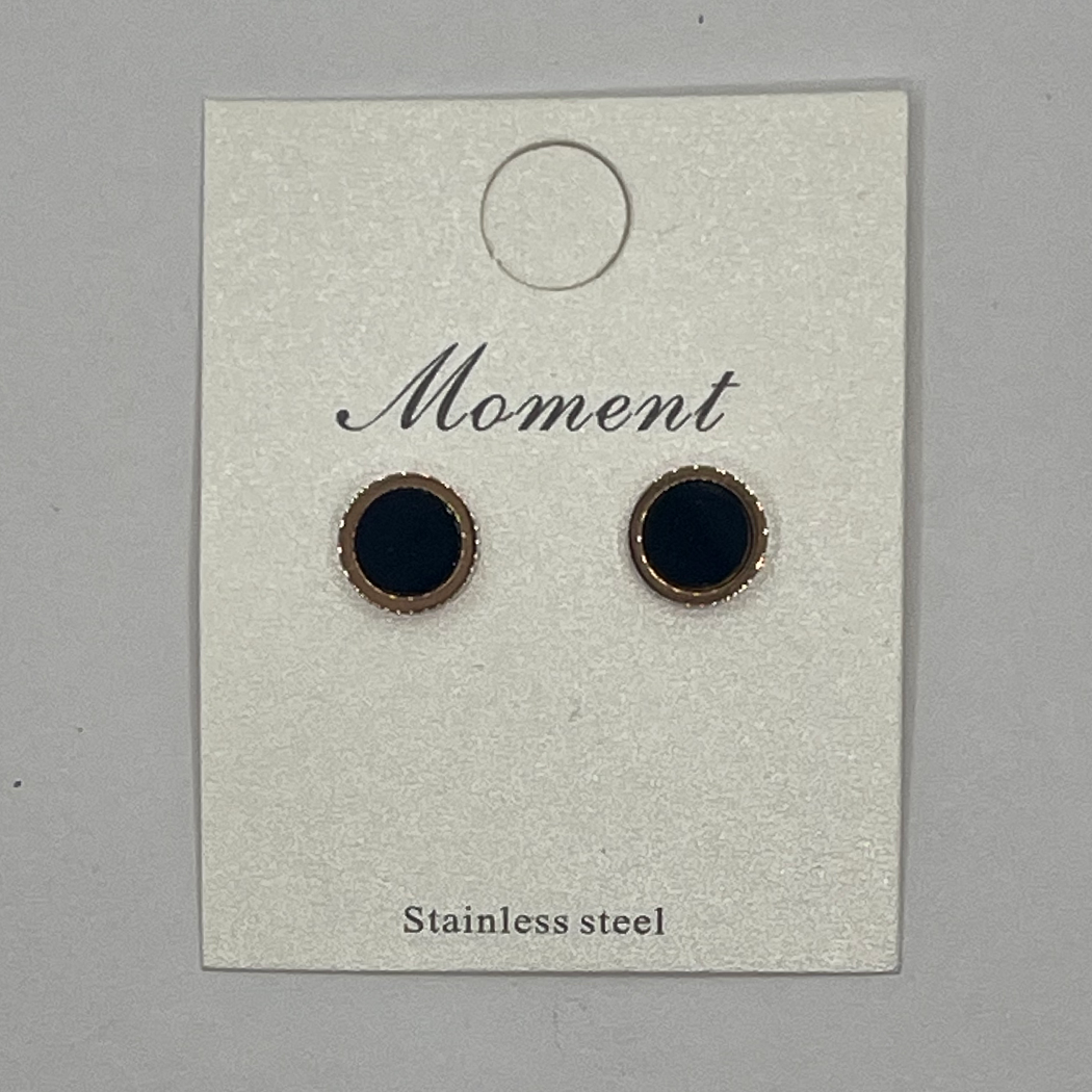 Pair of black earrings on a 'Moment' branded card with 'Stainless steel' text.